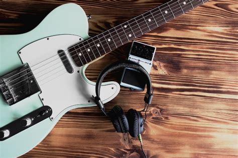 Can you play an electric guitar with headphones, and does it make the stars sing louder?